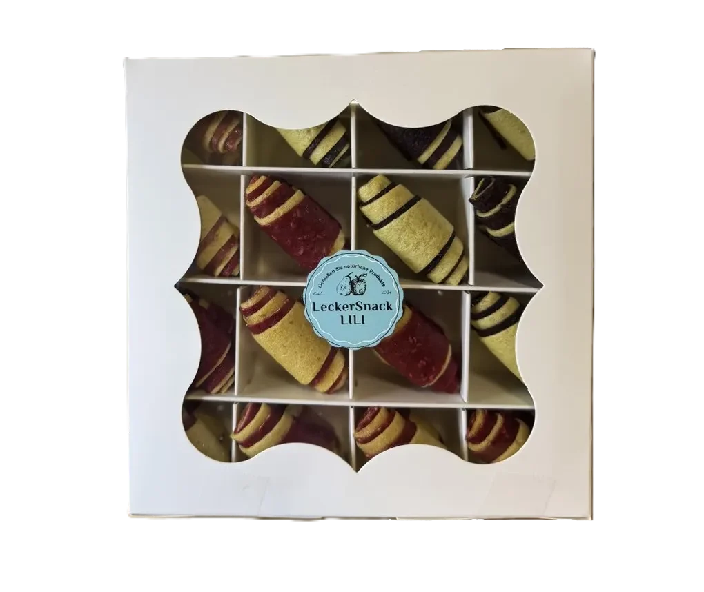 Weiße Geschenkbox in Bonbon-Form, gefüllt mit Fruchtleder-Rollen aus Ananas, Apfel, Himbeere und verschiedene beeren sorten 170g Mix.
