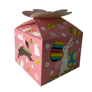 Eine rosa Geschenkbox mit weißen Hasen, bunten Ostereiern und floralen Elementen, dazu ein seitliches Sichtfenster.