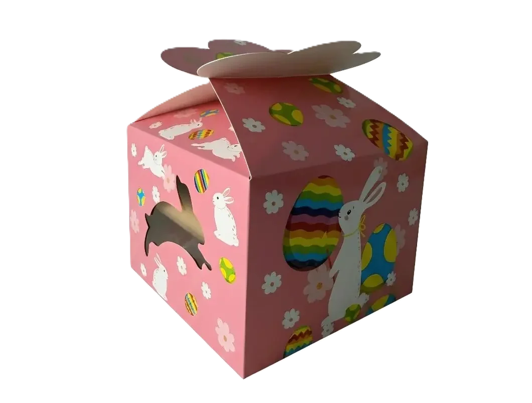 Eine rosa Geschenkbox mit weißen Hasen, bunten Ostereiern und floralen Elementen, dazu ein seitliches Sichtfenster.