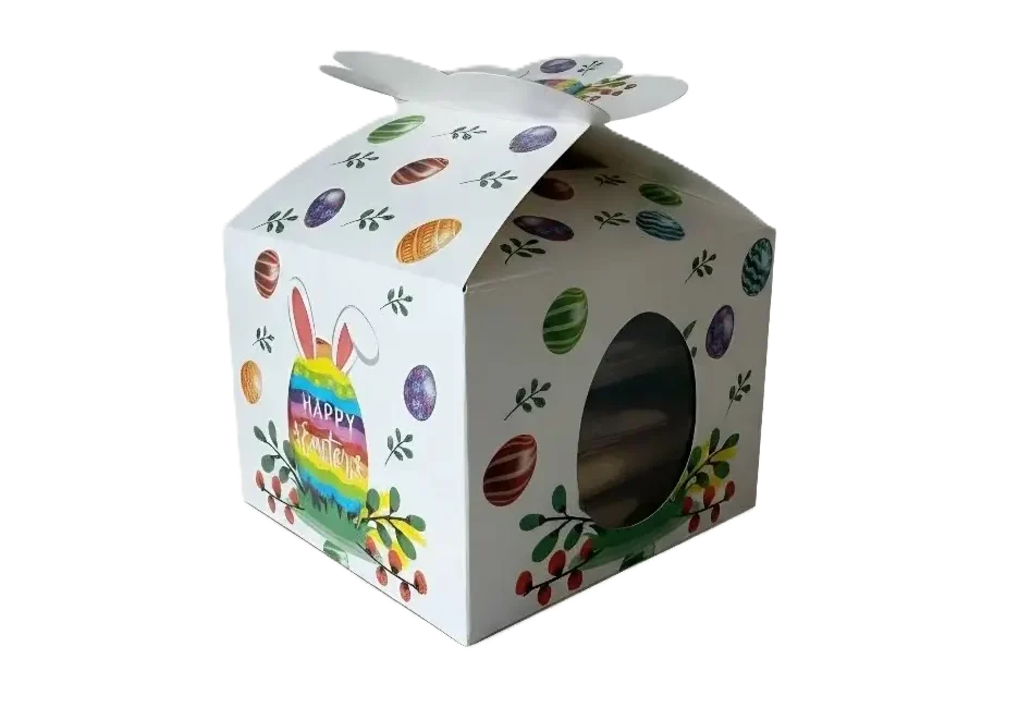 Weiße Oster-Geschenkbox mit bunten Ostereiern, Hasenohren und 'Happy Easter'-Schriftzug, dazu ein seitliches Sichtfenster.