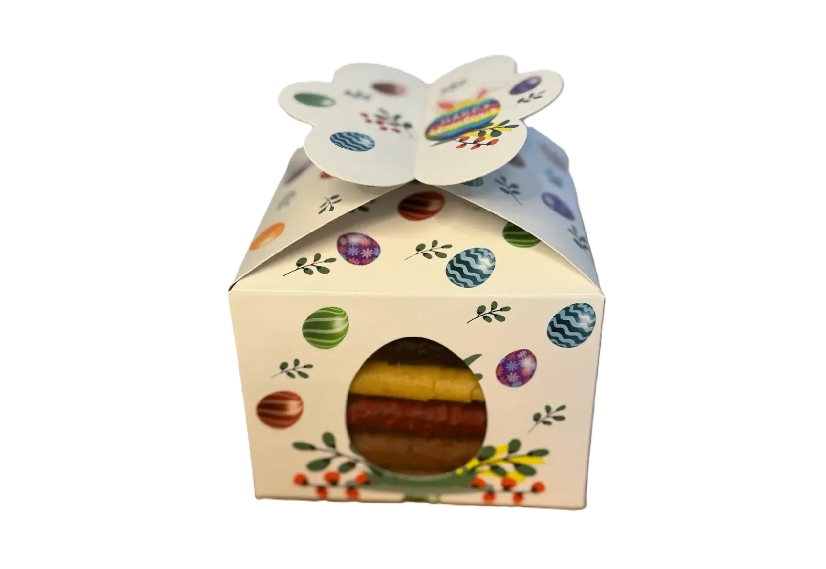 Weiße Oster-Geschenkbox mit bunten Ostereiern, Hasenohren und 'Happy Easter'-Schriftzug, dazu ein seitliches Sichtfenster.