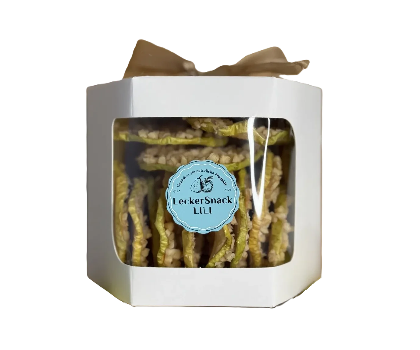 Weiße Geschenkbox mit Sichtfenster, gefüllt mit getrockneten Apfelringen, veredelt mit Mandelsplittern und Kokosraspeln.