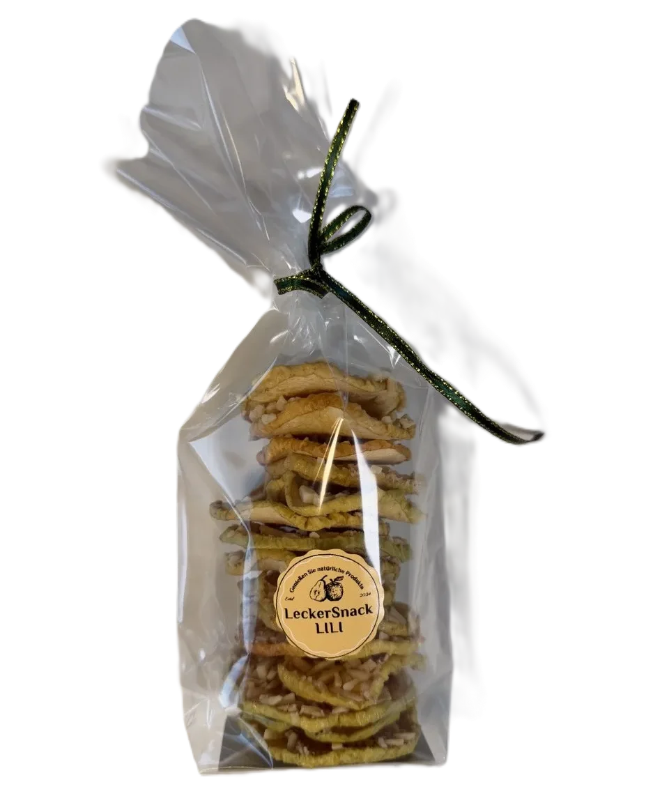 Klarsichtbeutel mit getrockneten Apfelringen, großzügig bestreut mit Mandelsplittern und Kokosflocken.