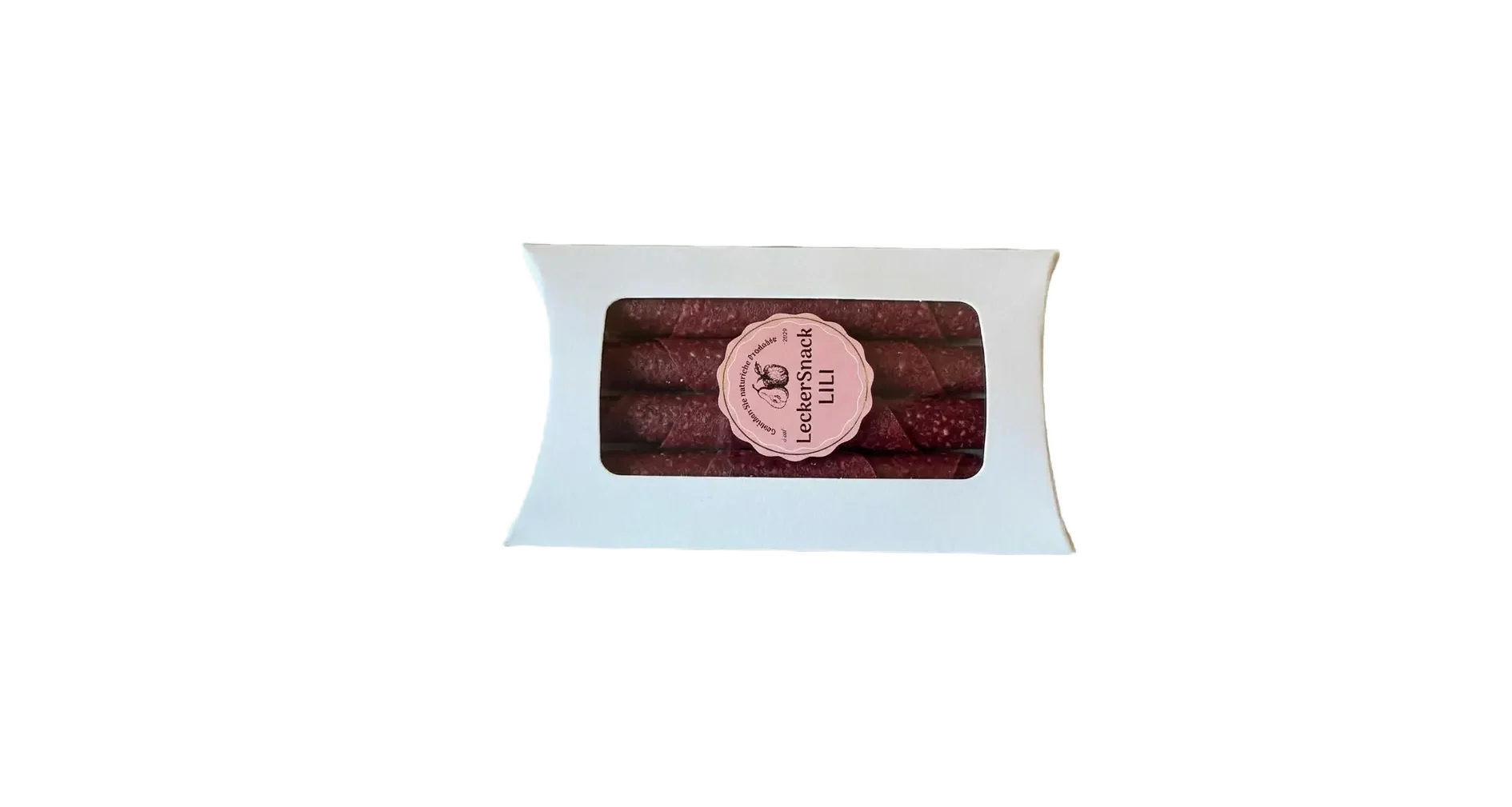 Weiße Geschenkbox mit Sichtfenster, gefüllt mit zahlreichen dunkelroten Himbeer-Fruchtleder-Rollen und Siegel.