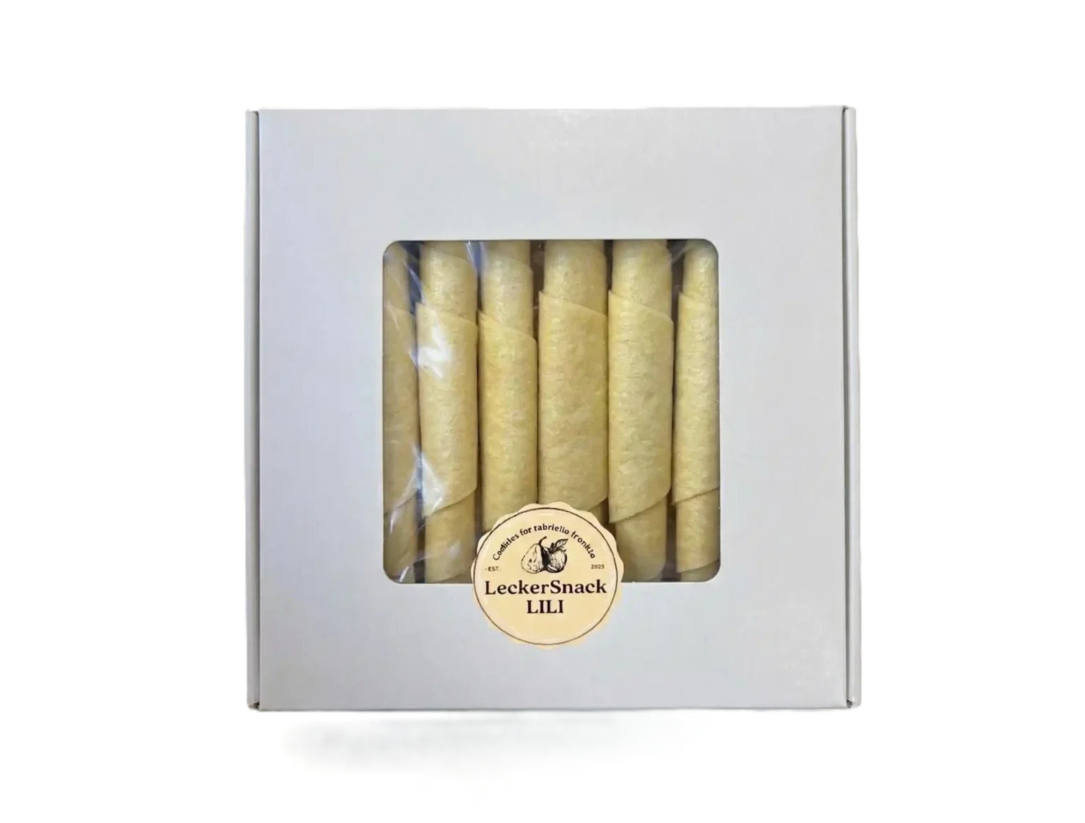 Weiße Geschenkbox mit Sichtfenster, gefüllt mit hellorangefarbenen Melonen-Fruchtleder-Rollen und LeckerSnackLILI Siegel.